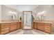 Spa-like bathroom featuring dual sinks, vanity, and a glass enclosed walk-in shower at 116 E Mountain Sky Ave, Phoenix, AZ 85048