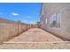 View of a side yard with gravel landscaping and block fence at 11952 W Villa Chula Ln, Sun City, AZ 85373