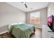 Comfortable bedroom featuring a ceiling fan, and a large window at 11952 W Villa Chula Ln, Sun City, AZ 85373