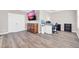 Bonus room/office featuring wood flooring, TV and desk at 11952 W Villa Chula Ln, Sun City, AZ 85373