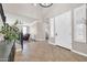 Inviting foyer with tile flooring, staircase, and large windows, offering a bright and welcoming entrance at 11952 W Villa Chula Ln, Sun City, AZ 85373