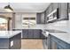 Kitchen features stainless steel appliances, sleek countertops and plenty of natural light at 11952 W Villa Chula Ln, Sun City, AZ 85373