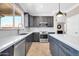 Kitchen features stainless steel appliances, sleek countertops and plentiful cabinet space at 11952 W Villa Chula Ln, Sun City, AZ 85373