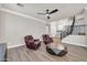 Living room with leather recliners, geometric table and view to entryway at 11952 W Villa Chula Ln, Sun City, AZ 85373