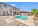 Large backyard pool with diving board, and patio, perfect for Gathering fun and relaxation at 11952 W Villa Chula Ln, Sun City, AZ 85373