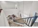Bright foyer featuring a long staircase and views to downstairs living area at 11952 W Villa Chula Ln, Sun City, AZ 85373