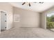Bedroom with a ceiling fan, and sliding glass doors lead to balcony at 12274 W Monroe St, Avondale, AZ 85323