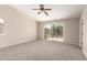 Spacious bedroom features sliding glass doors leading to outdoor balcony at 12274 W Monroe St, Avondale, AZ 85323
