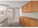 Carpeted hallway features built-in cabinets and bright neutral paint at 12274 W Monroe St, Avondale, AZ 85323