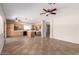 Spacious kitchen with stainless steel appliances and an island, and light wood cabinets at 12274 W Monroe St, Avondale, AZ 85323