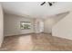 Neutral living room featuring tile flooring and a bright window at 12274 W Monroe St, Avondale, AZ 85323