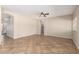 A well lit Living Room, features neutral color walls and tile flooring at 12274 W Monroe St, Avondale, AZ 85323