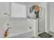 Clean bathroom with a soaking tub, glass-enclosed shower, and natural light from the window at 12375 W Whyman Ave, Avondale, AZ 85323
