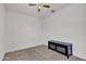 This cozy bedroom has neutral walls and a modern ceiling fan at 12375 W Whyman Ave, Avondale, AZ 85323