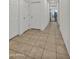 Hallway has tiled floors and doors, leading to other rooms at 12375 W Whyman Ave, Avondale, AZ 85323