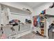 Organized walk-in closet with shelving and hanging space for clothes, shoes, and accessories at 12375 W Whyman Ave, Avondale, AZ 85323
