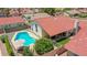Aerial view of a home featuring a pristine pool, charming patio, and well-maintained landscaping at 12641 S 39Th Pl, Phoenix, AZ 85044