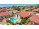 An aerial view of home with a pool, patio, desert landscaping and an inviting outdoor space at 12641 S 39Th Pl, Phoenix, AZ 85044