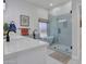 Spa-like bathroom with modern tub, glass shower, and double vanity at 12641 S 39Th Pl, Phoenix, AZ 85044