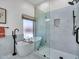 Bright bathroom featuring a soaking tub, glass enclosed shower, and modern fixtures at 12641 S 39Th Pl, Phoenix, AZ 85044