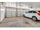 Spacious garage with a 2-car entrance and additional storage cabinets, providing ample parking and organization at 12641 S 39Th Pl, Phoenix, AZ 85044