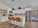 Bright kitchen with a large island, stainless steel appliances, and pendant lighting at 12641 S 39Th Pl, Phoenix, AZ 85044