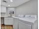 Laundry area featuring new front-load washer and dryer with quartz countertops at 12641 S 39Th Pl, Phoenix, AZ 85044