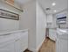 Bright laundry room with modern cabinetry, quartz countertops, and stainless steel fixtures at 12641 S 39Th Pl, Phoenix, AZ 85044