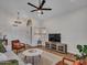 The living room features hardwood floors, a ceiling fan, and a decorative rug at 12641 S 39Th Pl, Phoenix, AZ 85044