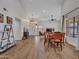 Inviting living room with hardwood floors, lots of natural light, and a cozy dining area at 12641 S 39Th Pl, Phoenix, AZ 85044