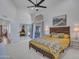 Spacious main bedroom featuring a ceiling fan and sliding glass door to the outdoor patio at 12641 S 39Th Pl, Phoenix, AZ 85044