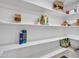 Walk-in pantry with ample shelving offering plenty of space for storage at 12641 S 39Th Pl, Phoenix, AZ 85044