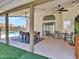 Covered patio with dining area, ceiling fan, and views of the swimming pool, perfect for enjoying outdoor living and entertaining at 12641 S 39Th Pl, Phoenix, AZ 85044
