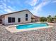 Back of the house with a private pool, diving board, and rock landscaping, perfect for outdoor enjoyment at 12641 S 39Th Pl, Phoenix, AZ 85044