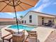 An inviting swimming pool with a lounge area is surrounded by stone and provides comfortable seating at 12641 S 39Th Pl, Phoenix, AZ 85044
