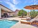Relaxing poolside view with patio seating and a covered dining area, perfect for outdoor enjoyment at 12641 S 39Th Pl, Phoenix, AZ 85044