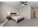 Cozy bedroom with carpet, ceiling fan, and neutral colors, creating a relaxing atmosphere at 1321 E Monteleone St, San Tan Valley, AZ 85140