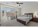 Inviting main bedroom with plush carpet, a large window, and modern furnishings, creating a cozy retreat at 1321 E Monteleone St, San Tan Valley, AZ 85140