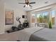 Bright bedroom offering ample natural light, carpet, and dedicated workout area at 1321 E Monteleone St, San Tan Valley, AZ 85140