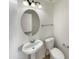 Powder room with a pedestal sink and tile flooring at 1415 E Chipman Rd, Phoenix, AZ 85040
