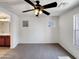 Clean, bright bedroom with a ceiling fan and ensuite bathroom at 1415 E Chipman Rd, Phoenix, AZ 85040