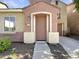 Charming home entrance with a cozy covered porch and a well-manicured garden at 1415 E Chipman Rd, Phoenix, AZ 85040