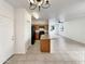 Open kitchen with an island, wood cabinets, and black appliances at 1415 E Chipman Rd, Phoenix, AZ 85040