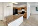 Functional kitchen with wood cabinetry, black appliances, and a convenient island at 1415 E Chipman Rd, Phoenix, AZ 85040