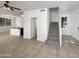 Open living area with a staircase, kitchen view, and lots of natural light at 1415 E Chipman Rd, Phoenix, AZ 85040
