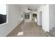 Bright living area with tile flooring, leading to the backyard through sliding glass doors at 1415 E Chipman Rd, Phoenix, AZ 85040