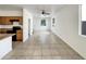Bright living room featuring neutral tile floors and a ceiling fan at 1415 E Chipman Rd, Phoenix, AZ 85040