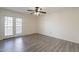 Spacious bedroom featuring modern flooring and access to the exterior at 1446 E Grovers Ave # 13, Phoenix, AZ 85022