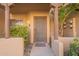 Inviting entryway features textured walls, desert landscaping, and covered entry with decorative wooden beams at 1446 E Grovers Ave # 13, Phoenix, AZ 85022