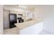 Cozy kitchen with black appliances and light tile floors at 1446 E Grovers Ave # 13, Phoenix, AZ 85022